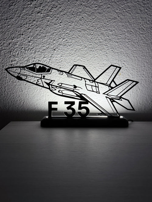 Silhouette 3D dell'aereo F35 in plastica nera con base LED