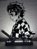 Lampada LED con silhouette 3D di Tanjiro Kamado su base illuminata
