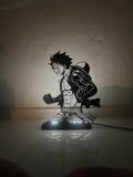 Silhouette 3D di Luffy in plastica nera con base LED