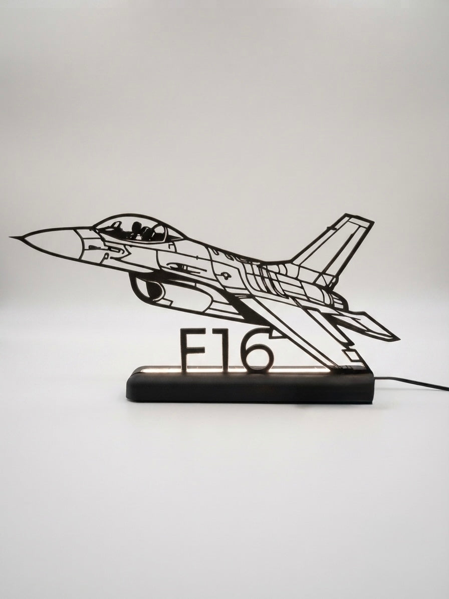 Lampada LED con silhouette 3D del caccia F16 su base illuminata