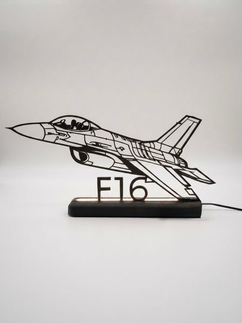 Lampada LED con silhouette 3D del caccia F16 su base illuminata