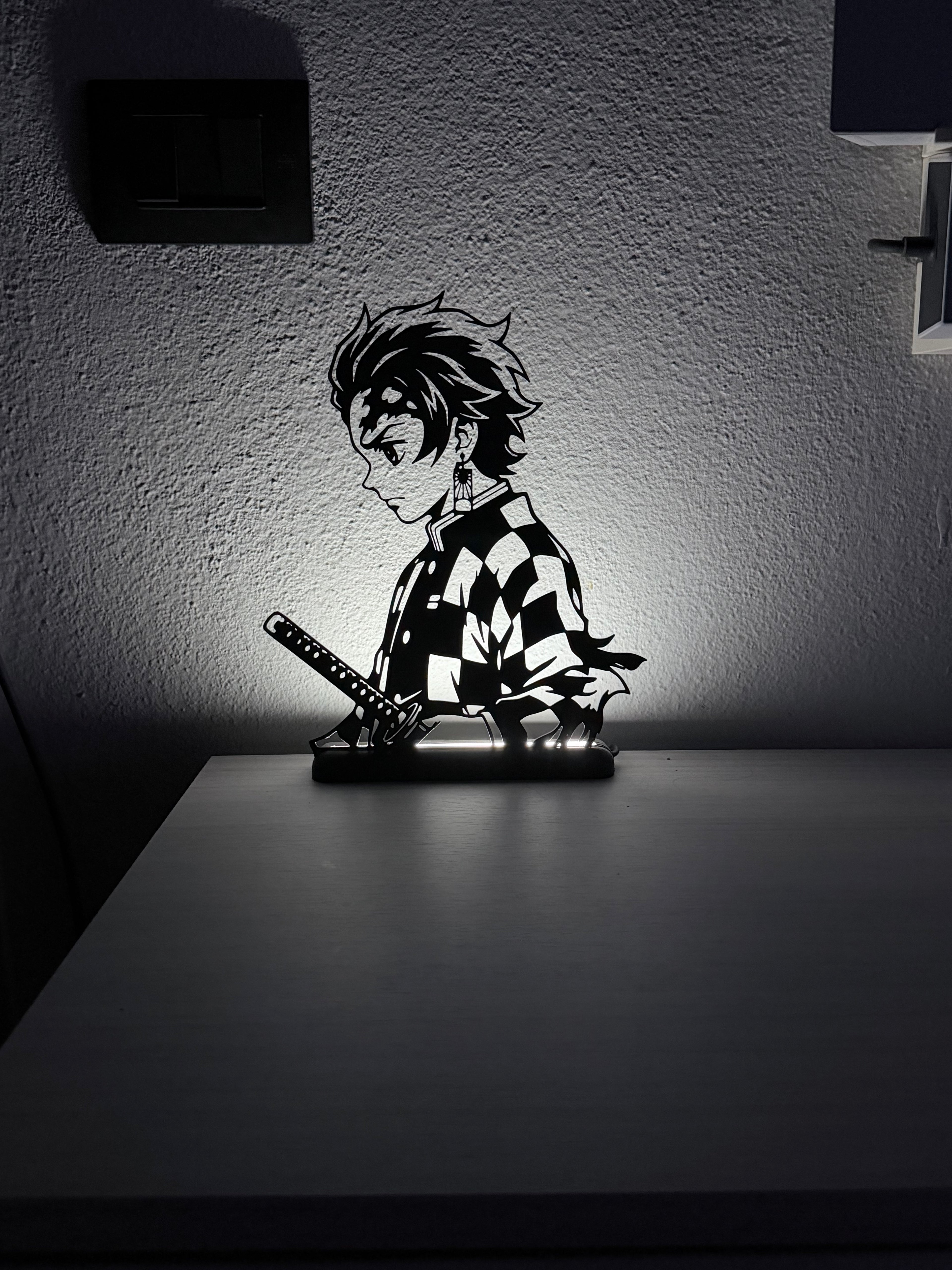 Silhouette 3D di Tanjiro di Demon Slayer in plastica nera