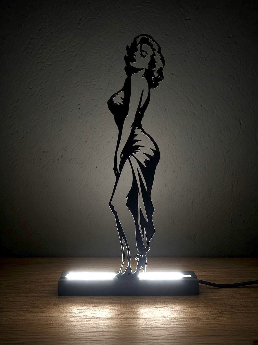 Lampada LED Marilyn Monroe di profilo accesa al buio